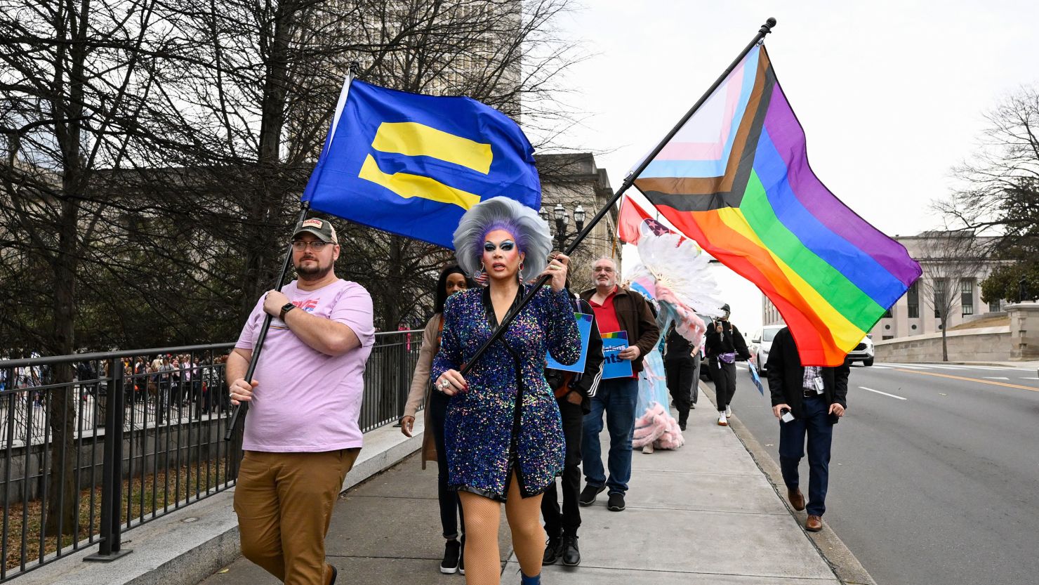 LGBTQ activists march past the Tennessee State Capitol in Nashville on February 14, 2023. 