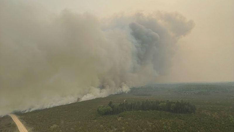NextImg:Northern Michigan wildfire burns through 3,600 acres, forcing evacuations and the closure of a nearby highway | CNN