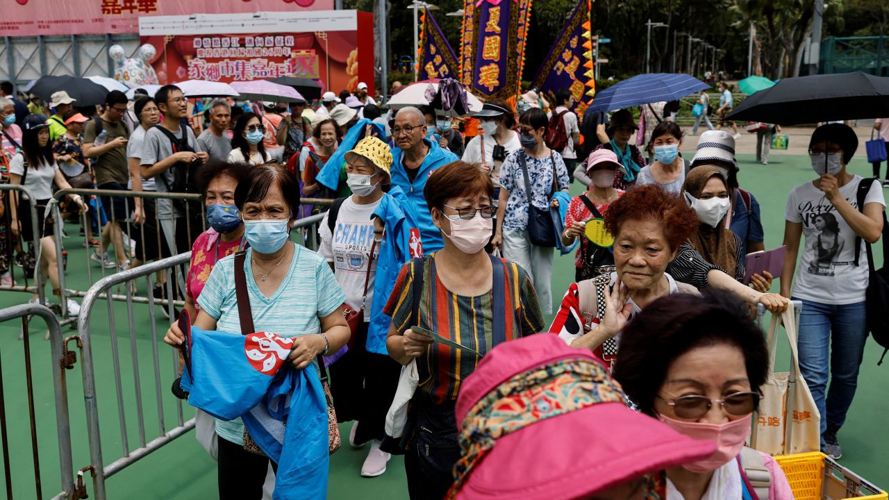 Visitors walk at the Chinese food carnival held by pro-China groups, taking place where the candlelight vigil used to be held, ahead of the 34th anniversary of the crackdown on pro-democracy demonstrations at Beijing's Tiananmen Square in Hong Kong on June 3, 2023. 