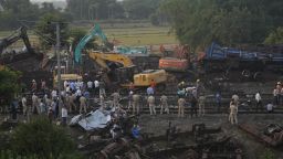 Policemen stand guard at the site where trains that derailed, in Balasore district, in the eastern Indian state of Orissa, Sunday, June 4, 2023. Indian authorities end rescue work and begin clearing mangled wreckage of two passenger trains that derailed in eastern India, killing over 300 people and injuring hundreds in one of the country's deadliest rail crashes in decades. (AP Photo/Rafiq Maqbool)