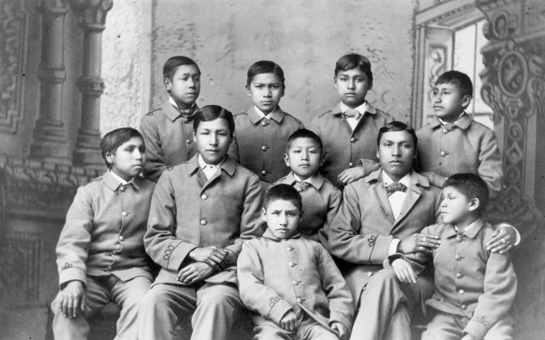 At Carlisle Indian school, Pennsylvania, a group of Omaha Indian boys appear in cadet uniforms, circa 1880. 