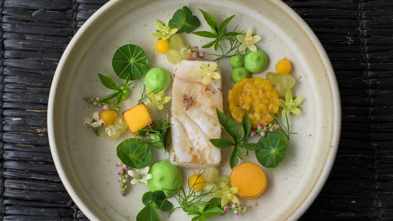 The delicately plated fillet of Nile perch, surrounded by dollops of creamy avocado puree, tangy mango rougail, and edible wildflowers, looks almost too good to eat — almost. It's the work of Dieuveil Malonga, who is on a mission to elevate African cuisine and promote the continent's culinary heritage and distinctive flavors through his innovative "Afro-fusion" cuisine. <strong>Look through the gallery to see more of the creative chef's picture perfect dishes.</strong>