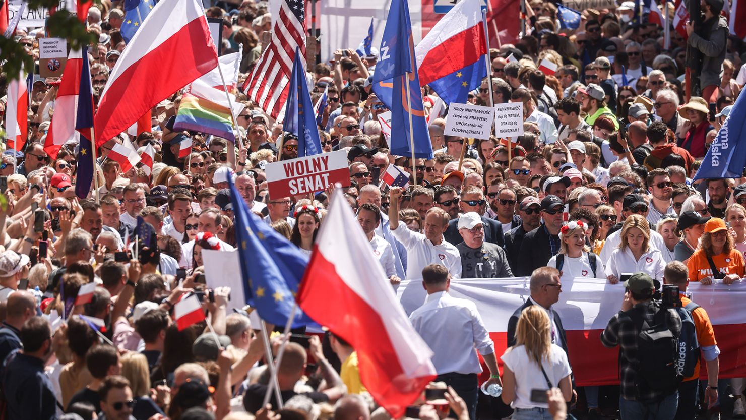 Opposition leader Donald Tusk and Lech Walesa, the former President of Poland and the former leader of the Solidarity movement, attend an anti-government march in Warsaw on June 4, 2023.