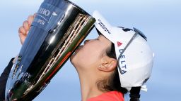 Rose Zhang kisses the trophy after winning the Mizuho Americas Open golf tournament Sunday in Jersey City.