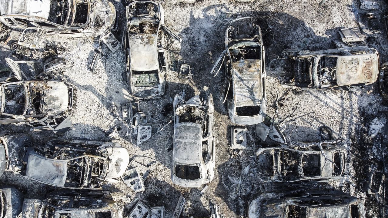 An aerial view shows vehicles torched by Israeli settlers in an attack on Huwara on February 26, triggered by the killing of two Israelis in the occupied West Bank town.