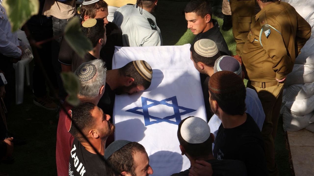 Mourners take part in the funeral for the Yaniv brothers at the military cemetery in Jerusalem on February 27.