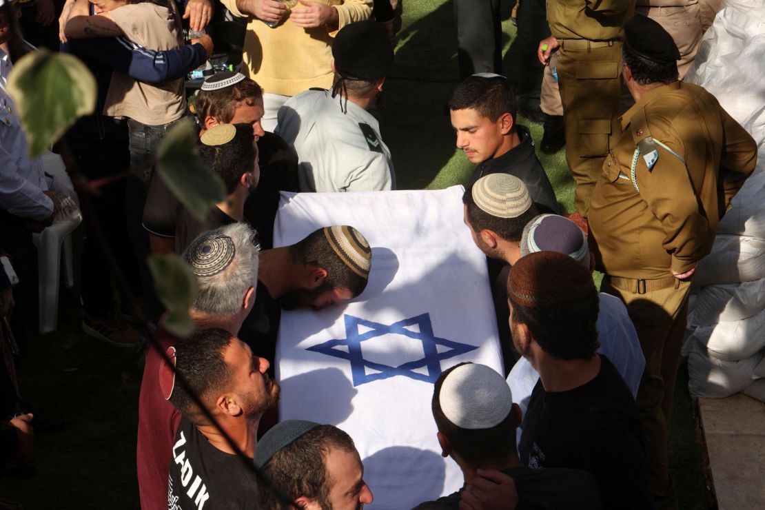 Mourners take part in the funeral for the Yaniv brothers at the military cemetery in Jerusalem on February 27.