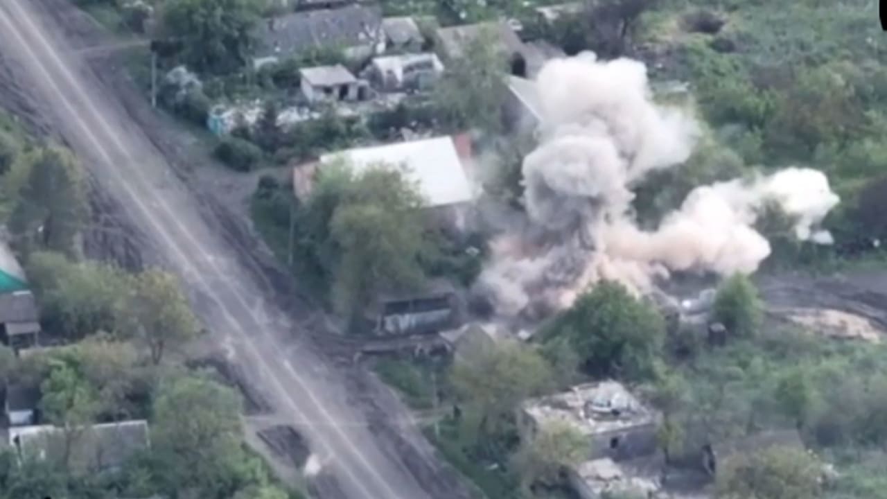 This screengrab taken from video geolocated by CNN appears to show a shelling attack in the village of Staromaiors'ke in Ukraine's Donetsk Oblast. CNN cannot independently verify the specifics of the incident or the exact date the video was shot.
