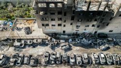 This picture taken on February 27, 2023 shows an aerial view of a scrapyard where cars were torched overnight, in the Palestinian town of Huwara near Nablus in the West Bank.