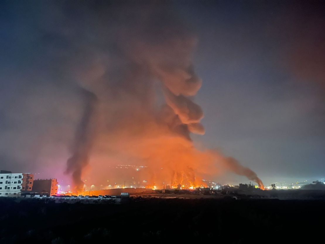 Smoke rises over Huwara after Israeli settlers rampaged through the town, setting fire to homes, businesses and cars.