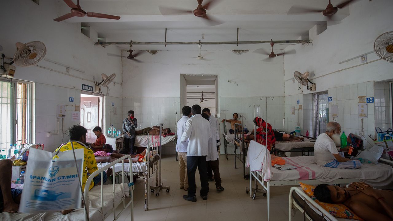 Doctors confer as they attend to survivors of a train accident in a hospital in Balasore, India, on June 4, 2023.