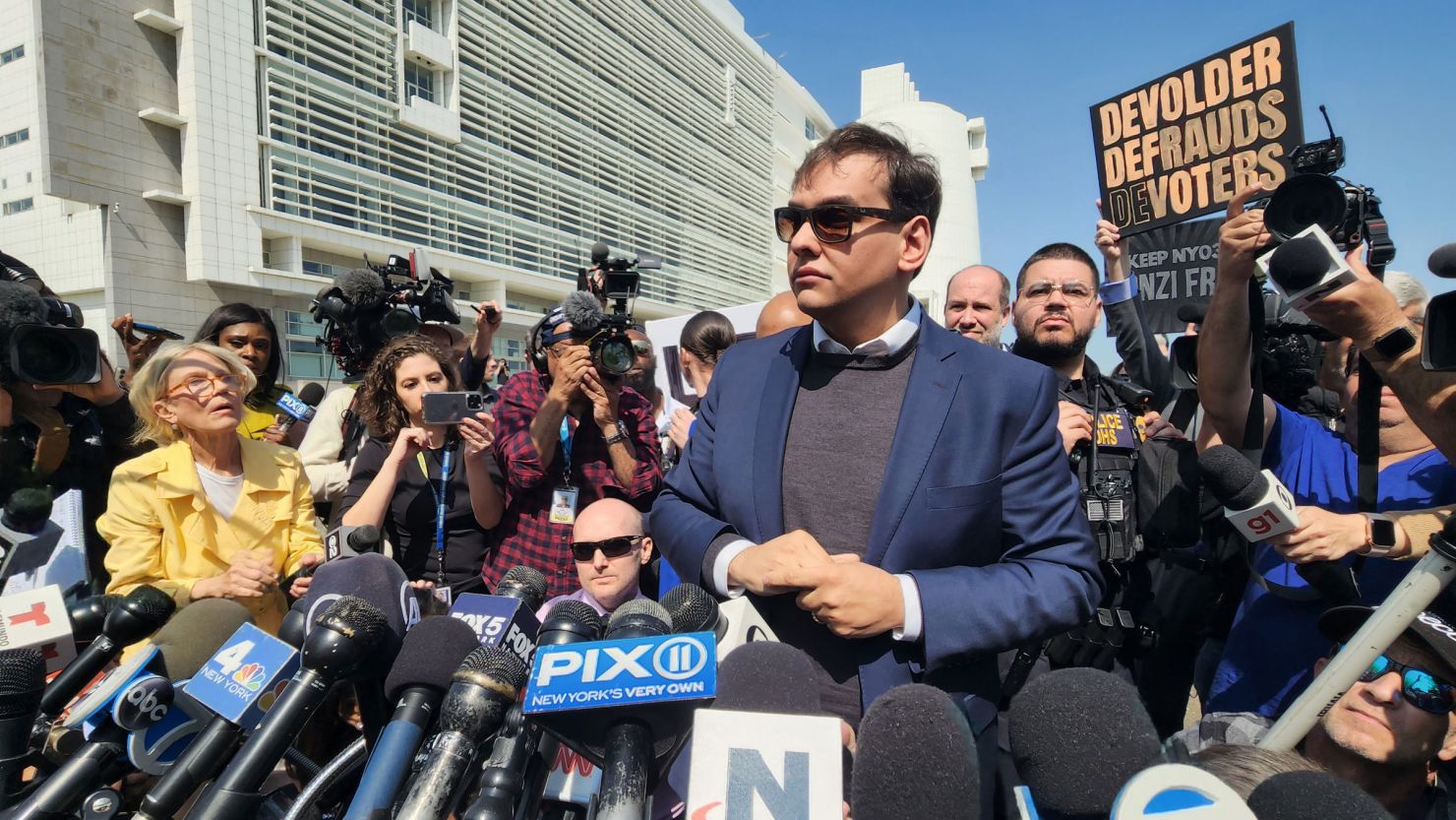Congressman George Santos speaks at a press conference held outside the federal courthouse in Central Islip, New York, after pleading not guilty to 13 federal criminal charges, on May 10, 2023. 
