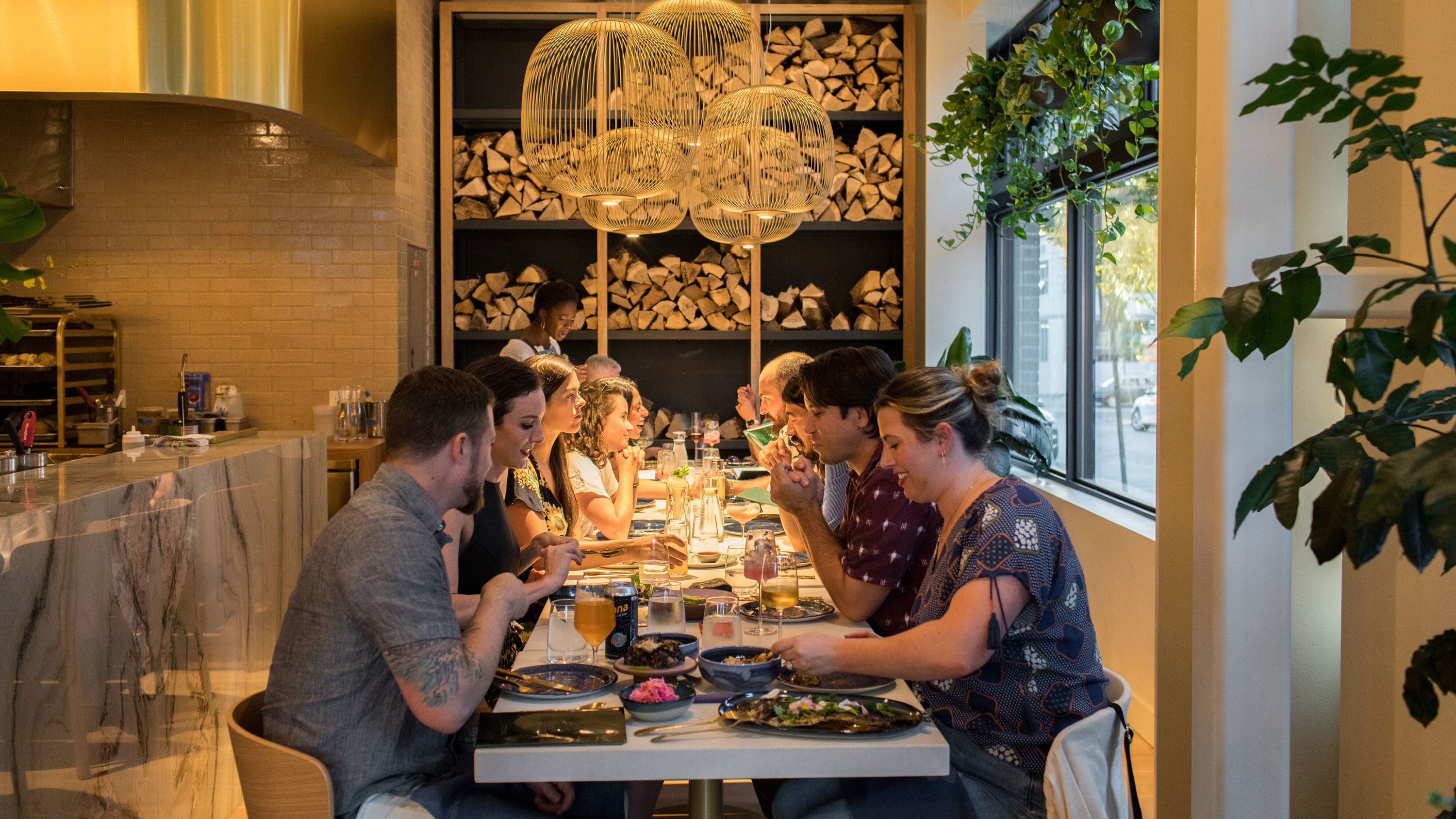 FILE -- Diners at Kann in Portland, Ore., Aug. 25, 2022. Briny flavors, high-end Jell-O shots, a fascination with outer space and a concern for Earth will guide our choices. At least that's what the food forecasters say. (Celeste Noche/The New York Times)