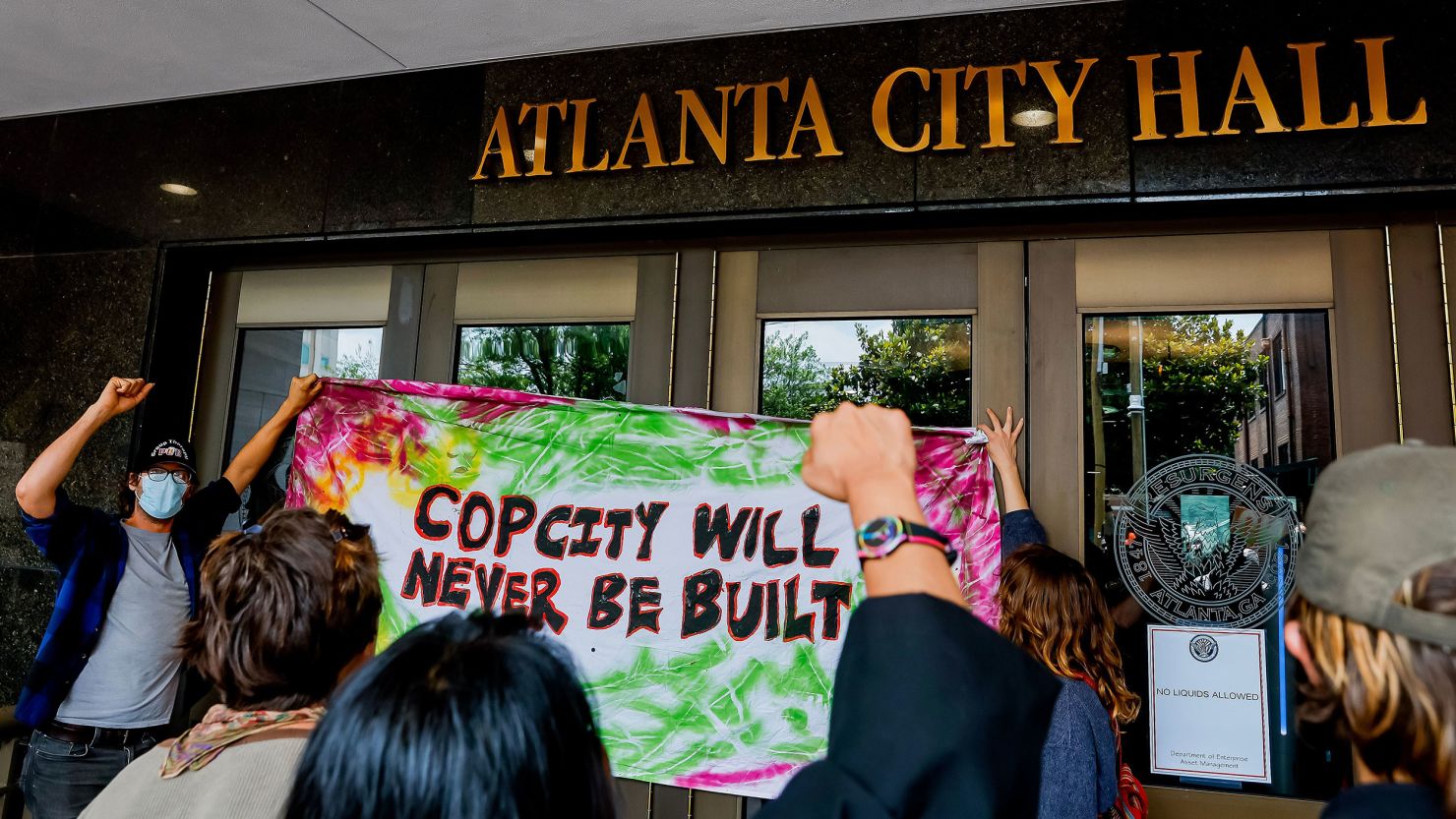 Opponents to the planned Atlanta Public Safety Training Center protest at Atlanta City Hall Monday.