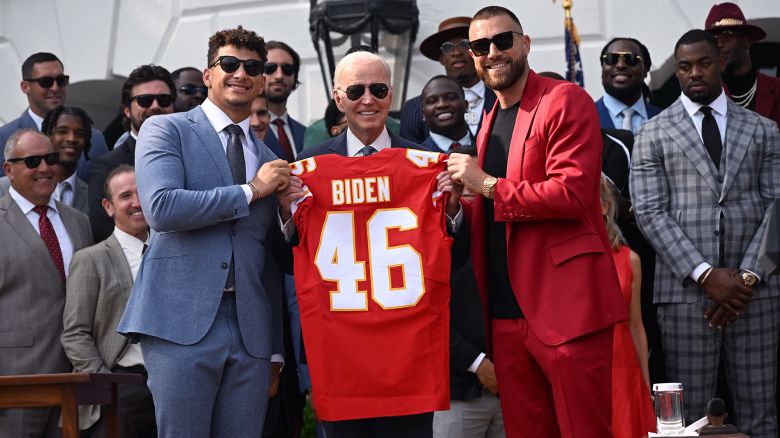 Kansas City Chiefs tight end Travis Kelce and quarterback Patrick Mahomes present US President Joe Biden with a jersey during a celebration for the Kansas City Chiefs, 2023 Super Bowl champions, on the South Lawn of the White House in Washington, DC, on June 5, 2023. (Photo by ANDREW CABALLERO-REYNOLDS / AFP) (Photo by ANDREW CABALLERO-REYNOLDS/AFP via Getty Images)