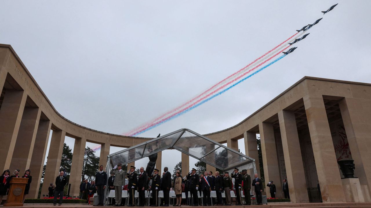 A French elite acrobatic flying team "Patrouille de France" (PAF) flies over during a ceremony at the Normandy American Cemetery and Memorial as part of the 79th anniversary of the World War II D-Day Normandy landings in Colleville-sur-Mer, Normandy, on June 6.
