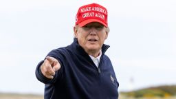 Former U.S. President Donald Trump gestures during a round of golf at his Turnberry course on May 2, 2023 in Turnberry, Scotland.