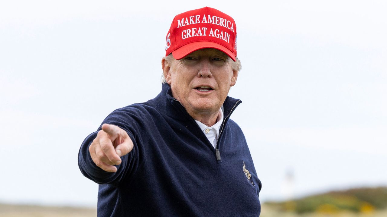 Trump gestures during a round of golf at his Turnberry course on May 2, 2023.
