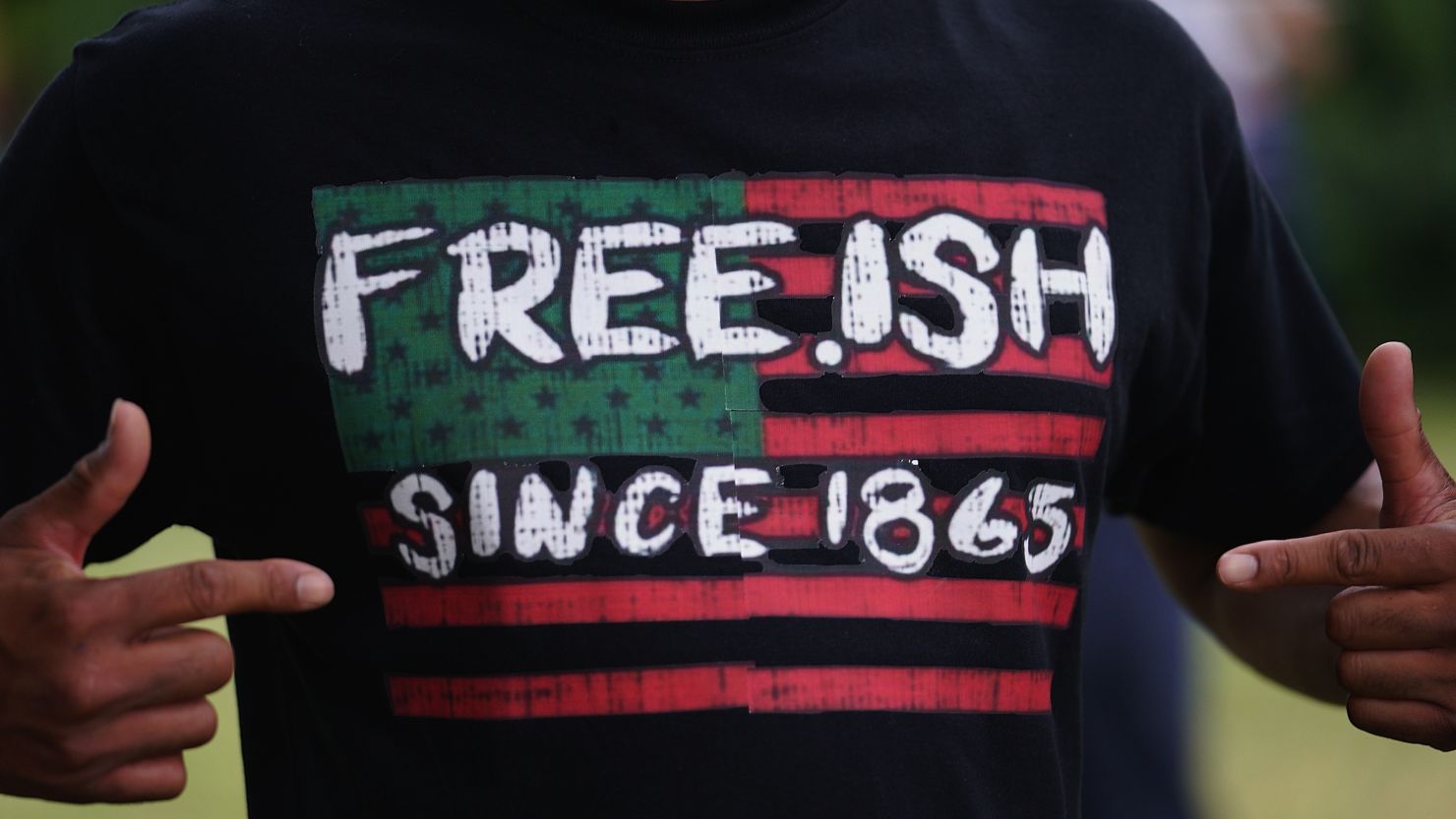 A man sports a shirt celebrating Black freedom during 2020 Juneteenth observances in Tulsa, Oklahoma.