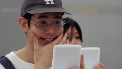 Japanese students relearn to smile