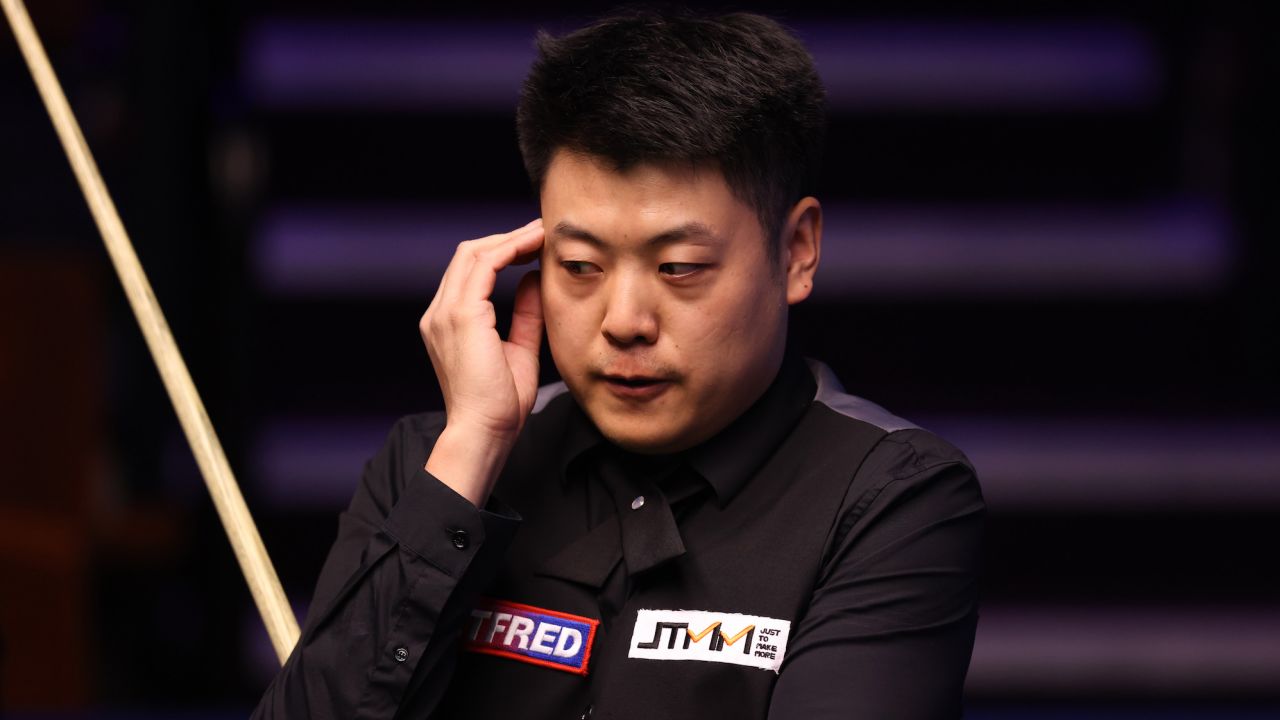 SHEFFIELD, ENGLAND - APRIL 18: Liang Wenbo of China reacts during the Betfred World Snooker Championship Round One match between Liang Wenbo of China and Neil Robertson of Australia at Crucible Theatre on April 18, 2021 in Sheffield, England. A maximum of 33% of the venue capacity will be in attendance as part of a Government pilot event. (Photo by George Wood/Getty Images)