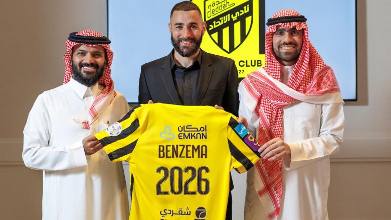 JEDDAH, SAUDI ARABIA - JUNE 06: (----EDITORIAL USE ONLY â" MANDATORY CREDIT - "AL ITTIHAD FOOTBALL CLUB / HANDOUT" - NO MARKETING NO ADVERTISING CAMPAIGNS - DISTRIBUTED AS A SERVICE TO CLIENTS----) 35 year-old French soccer star, Karim Benzema (C) holds a jersey of Al-Ittihad, a Saudi Arabian soccer team in Jeddah, Saudi Arabia on June 06, 2023. Benzema left Real Madrid and signed a 3 year contract with Al-Ittihad. (Photo by Al Ittihad Football Club / Handout/Anadolu Agency via Getty Images)