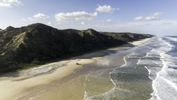 Aerial shot of driving along the beach on Fraser Island