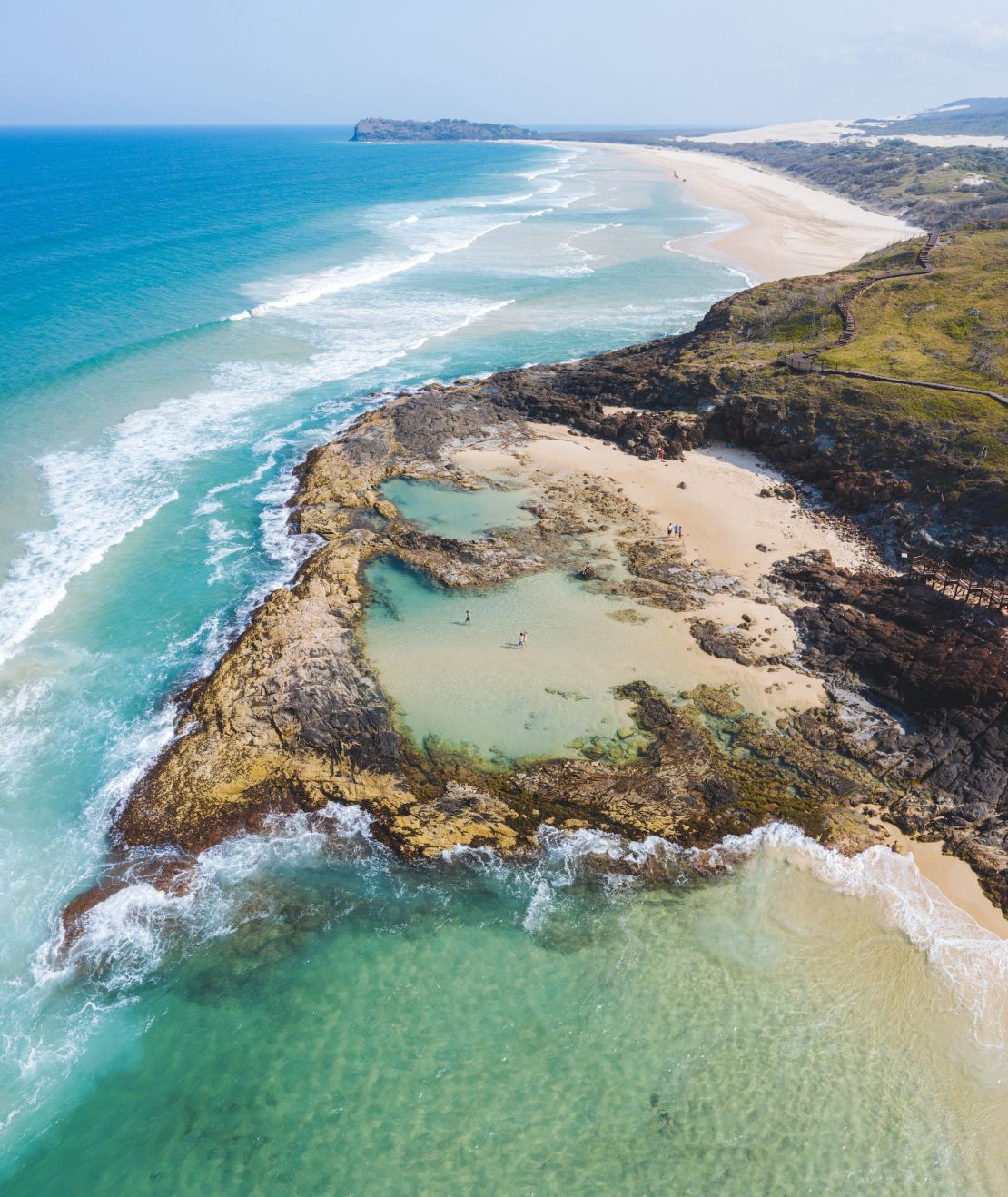 The island's famous Champagne Pools decorate its 75-mile beach.