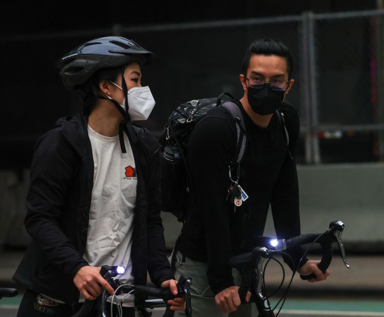 People in New York wear masks as they ride bikes on June 6. That morning, the city briefly had the world's worst levels of air pollution.