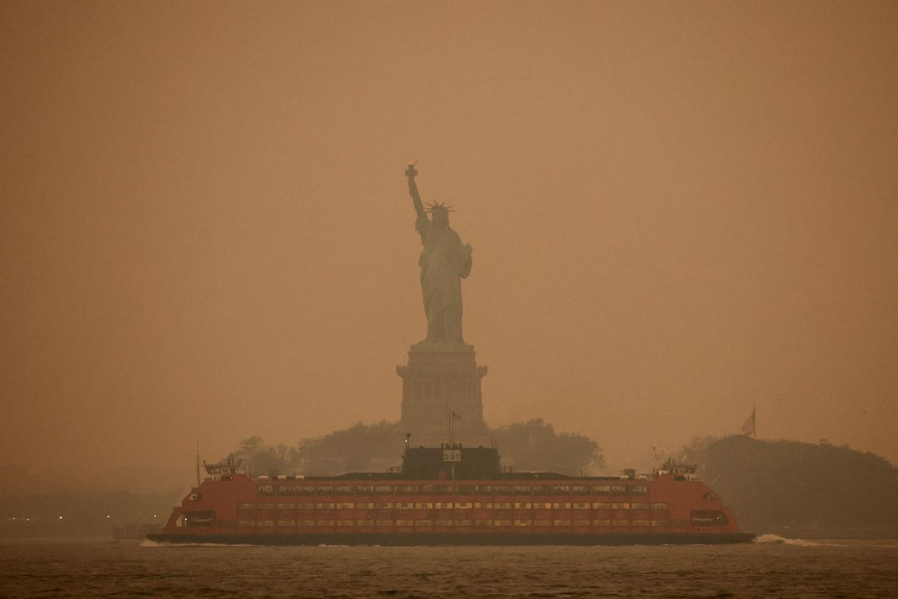 The Statue of Liberty is obscured by the air pollution in New York on June 6.