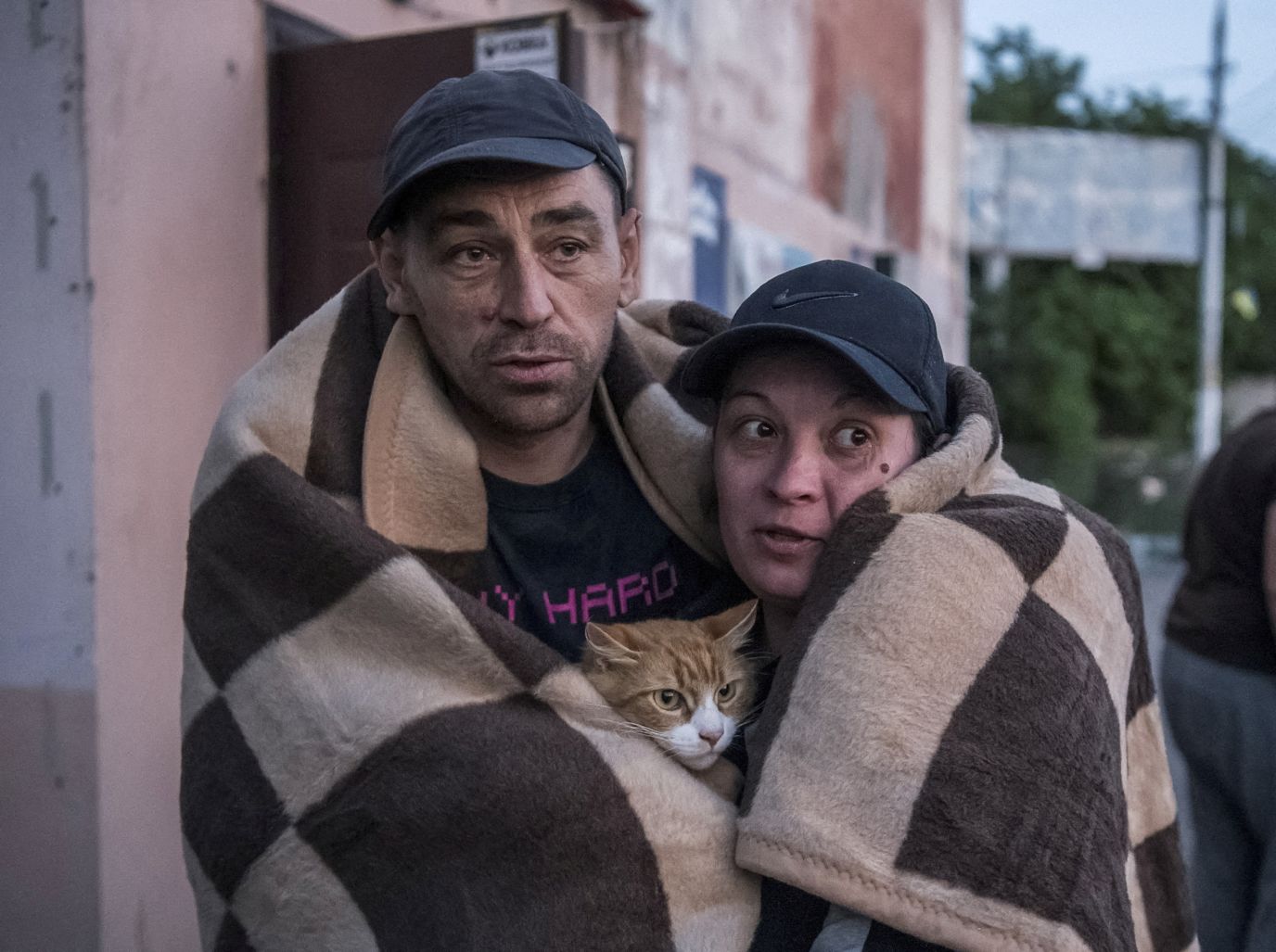 Local residents react after they evacuated a flooded area in Kherson.