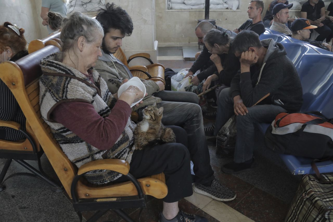 Evacuees wait for a train at a railway station in Kherson on June 6.