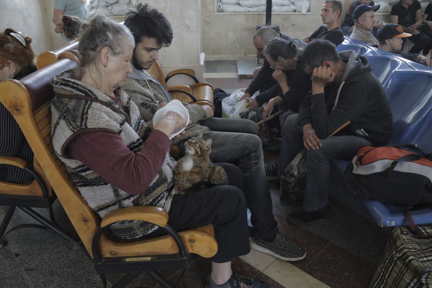 Evacuees wait for a train at a railway station in Kherson on June 6.