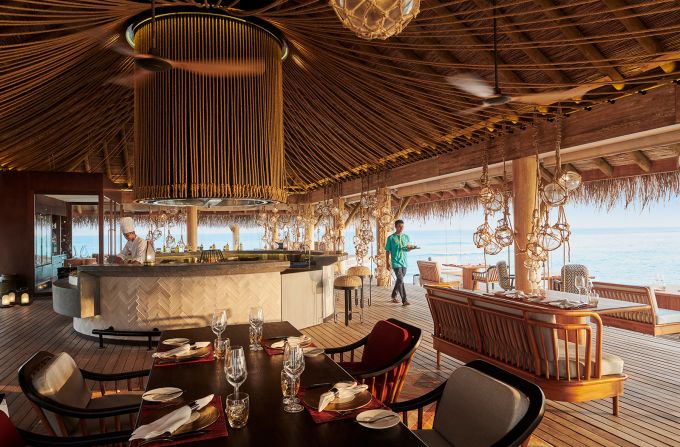 <strong>Azure:</strong> Guests have four restaurants to choose from. Pictured is Azure, which features a creative seafood menu that includes a huge variety of lobster dishes. It's not unusual to spot large reef sharks swimming in the waters below.  