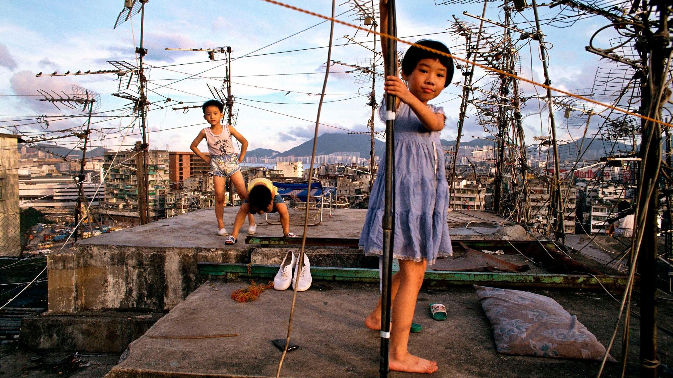 Greg Girard 'Children playing on Walled City rooftop', Hong Kong 1989, Courtesy of Blue Lotus Gallery