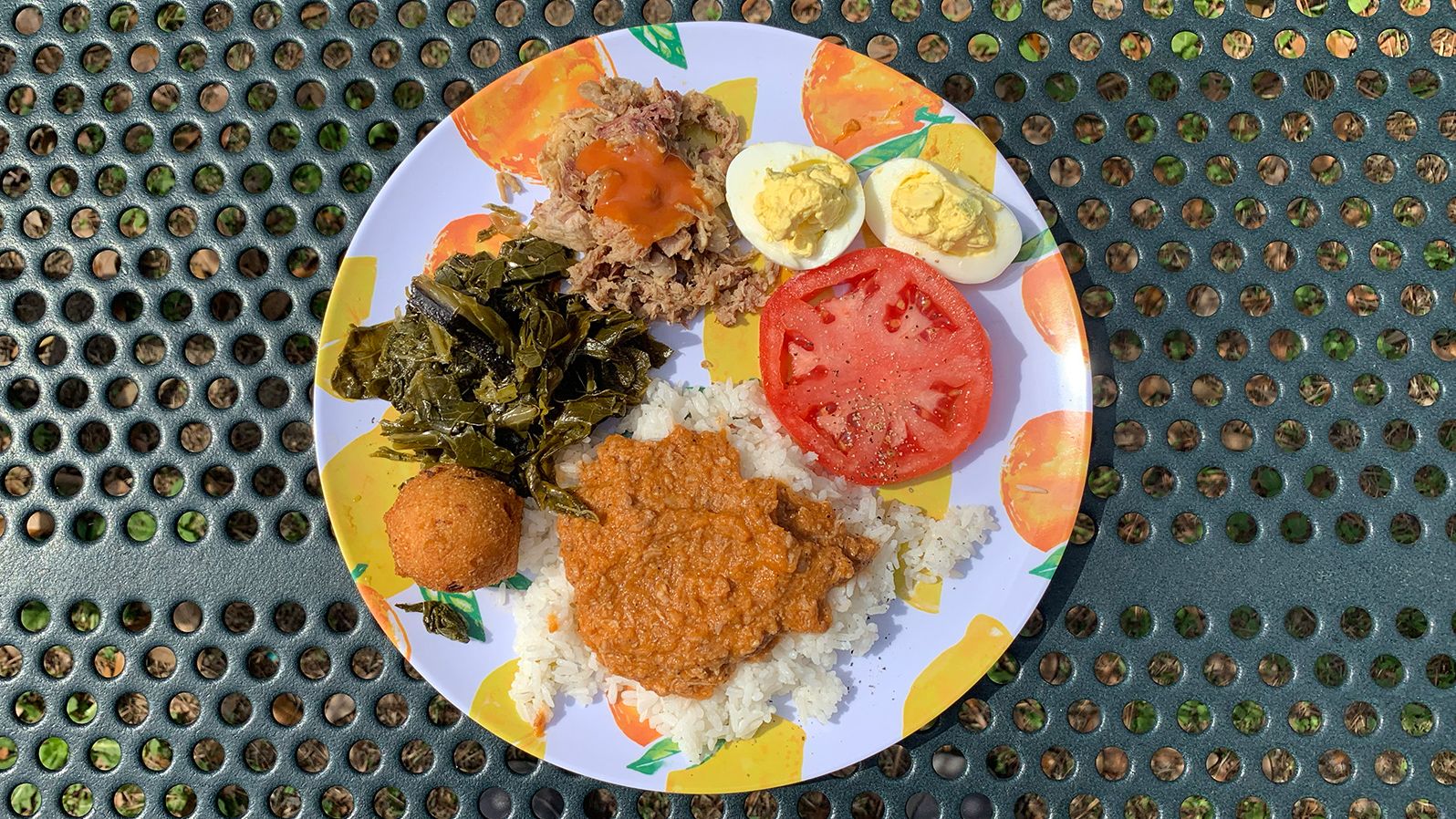 Hash on white rice is a South Carolina delicacy and anchors many a meal. Here's a typical plate in hash country (clockwise from top): Side of pulled pork barbecue, deviled eggs, fresh sliced tomato, barbecue hash on rice, hush puppy and collards.
