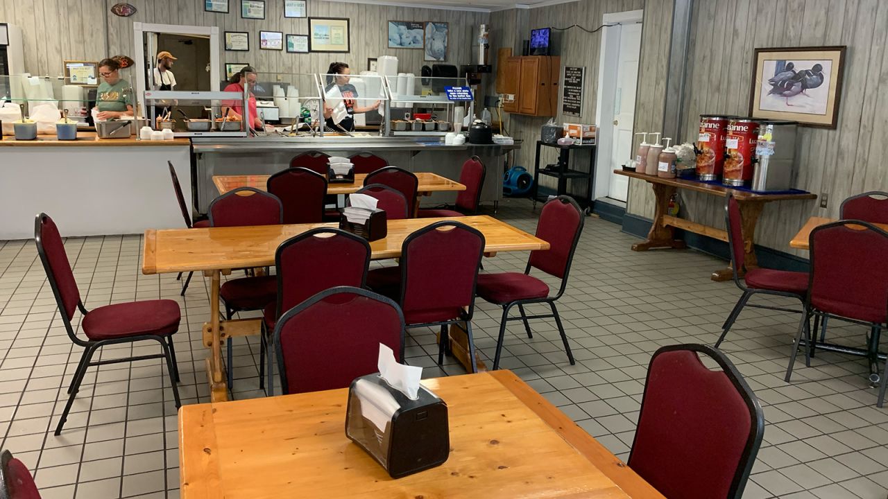 Staffers make last-minute preparations behind the buffet at Carolina Bar-B-Que in New Ellenton, South Carolina, on April 1, 2023.