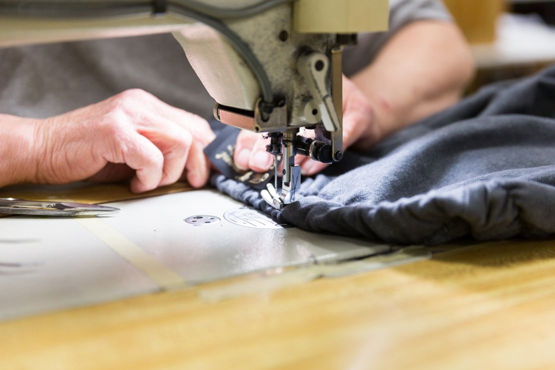 An employee is sewing at the Johnson, Vermont, production facility of The Vermont Flannel Company.