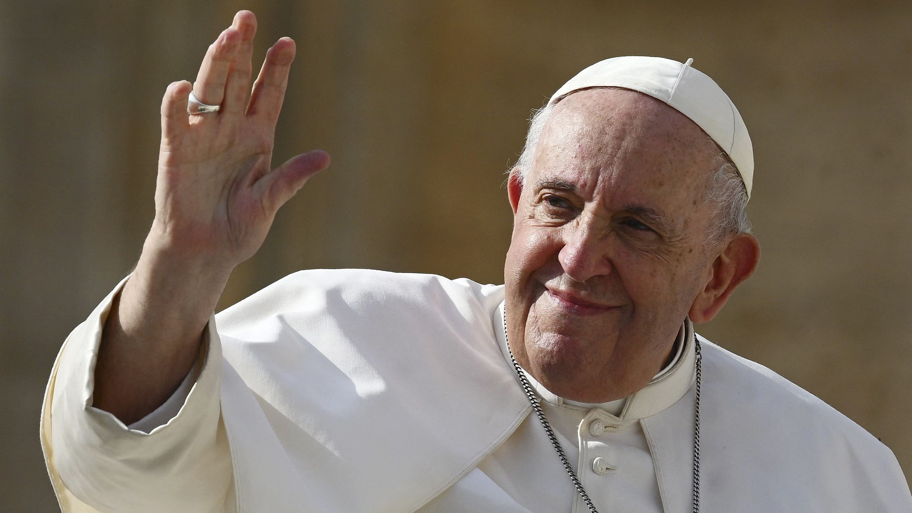 pope benedict waves to the crowd as he arrives for his weekly general audience