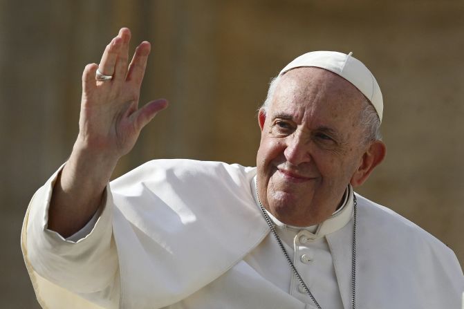 Pope Francis (L) waves at the end of his weekly general audience at Saint Peter's Square in the Vatican on October 26, 2022. (Photo by Vincenzo PINTO / AFP) (Photo by VINCENZO PINTO/AFP via Getty Images)