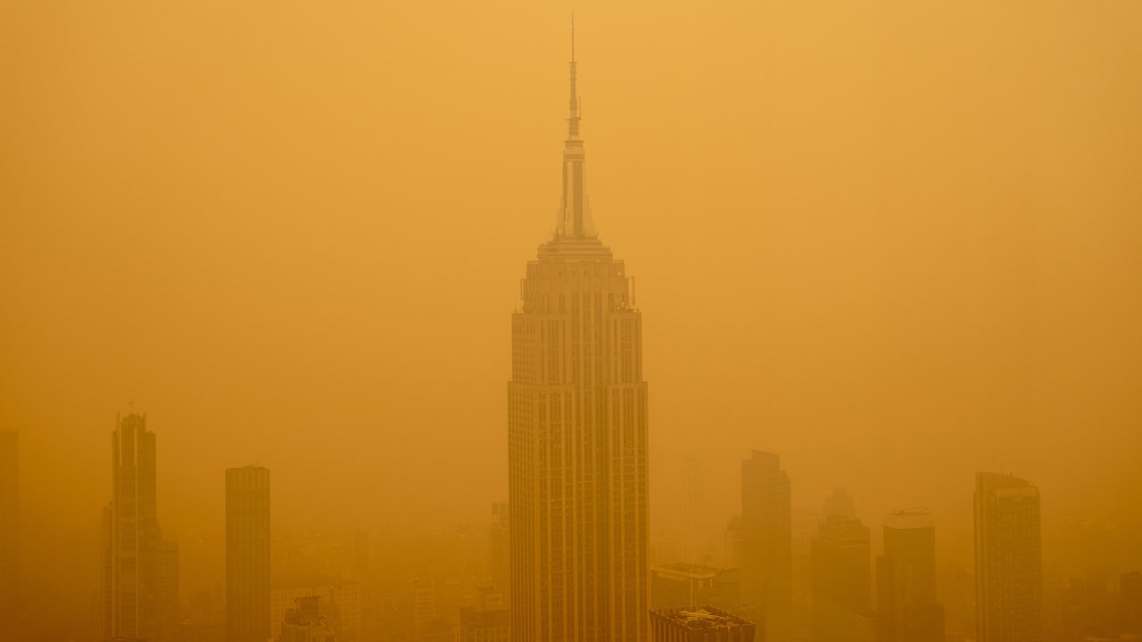NEW YORK, NEW YORK - JUNE 7: Smoky haze from wildfires in Canada diminishes the visibility of the Empire State Building on June 7, 2023 in New York City. New York topped the list of most polluted major cities in the world on Tuesday night, as smoke from the fires continues to blanket the East Coast. (Photo by David Dee Delgado/Getty Images)