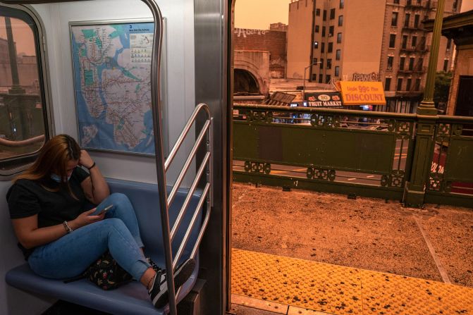 A person on the New York City subway wears a mask as smoky haze blankets a neighborhood on June 7.