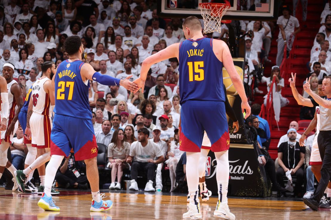 MIAMI, FL - JUNE 7: Jamal Murray #27 and Nikola Jokic #15 of the Denver Nuggets high five during Game Three of the 2023 NBA Finals against the Miami Heat on June 7, 2023 at Kaseya Center in Miami, Florida. NOTE TO USER: User expressly acknowledges and agrees that, by downloading and or using this Photograph, user is consenting to the terms and conditions of the Getty Images License Agreement. Mandatory Copyright Notice: Copyright 2023 NBAE (Photo by Nathaniel S. Butler/NBAE via Getty Images)