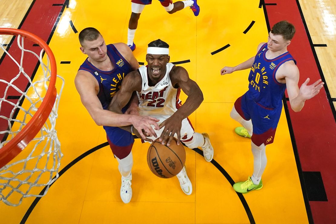 Jun 7, 2023; Miami, Florida, USA; Denver Nuggets center Nikola Jokic (15) knocks the ball away from Miami Heat forward Jimmy Butler (22) during the second half in game three of the 2023 NBA Finals at Kaseya Center. Mandatory Credit: Kyle Terada-USA TODAY Sports