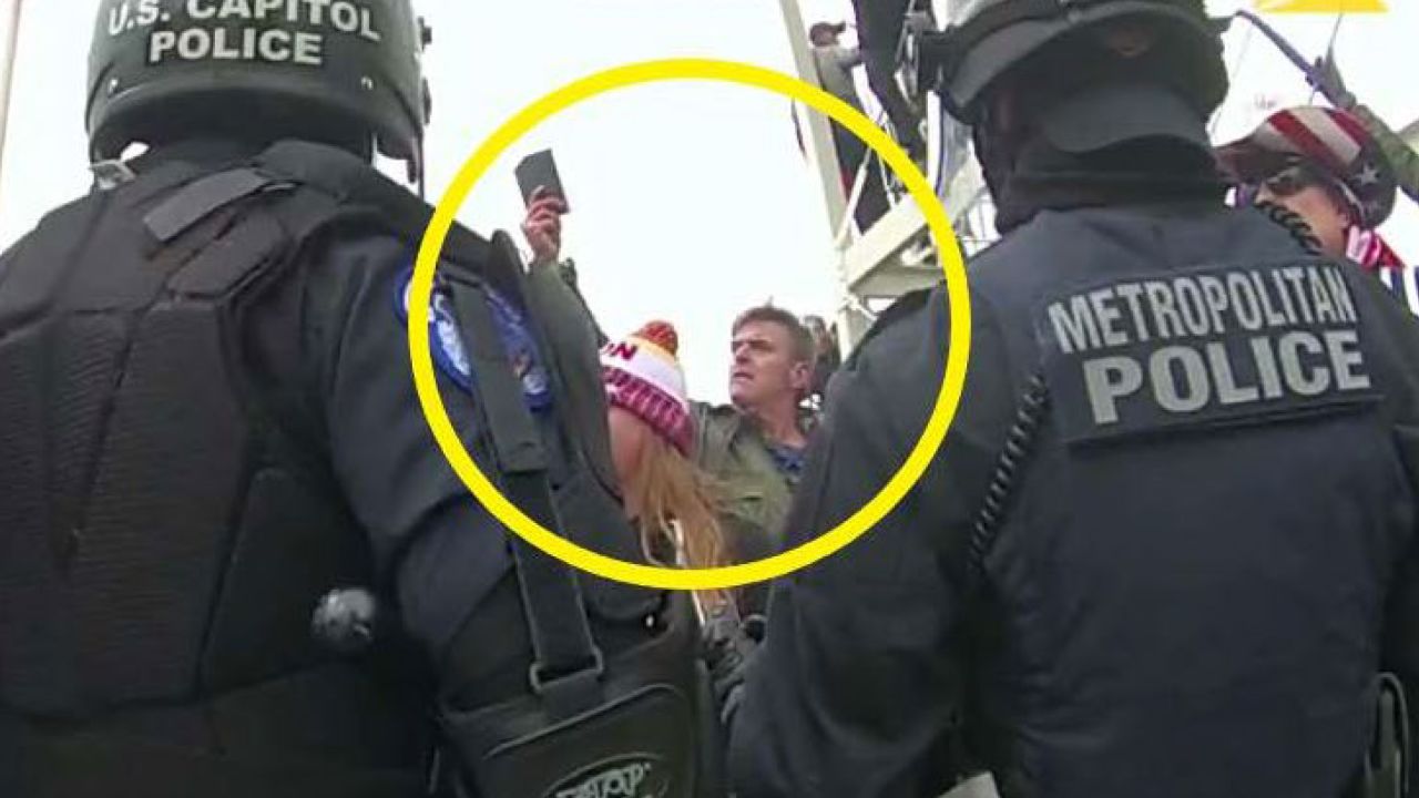This image from Washington Metropolitan Police Department body-worn video, released and annotated by the Justice Department in the statement of facts supporting an arrest warrant for Jay James Johnston, shows Johnston, circled in yellow, at the U.S. Capitol on Jan. 6, 2021, in Washington. Johnston, the actor known for his roles on the comedy television shows "Bob's Burgers" and "Mr. Show with Bob and David" has been arrested on charges that he joined a mob of Donald Trump supporters in confronting police officers during the U.S. Capitol riot. (Justice Department via AP)