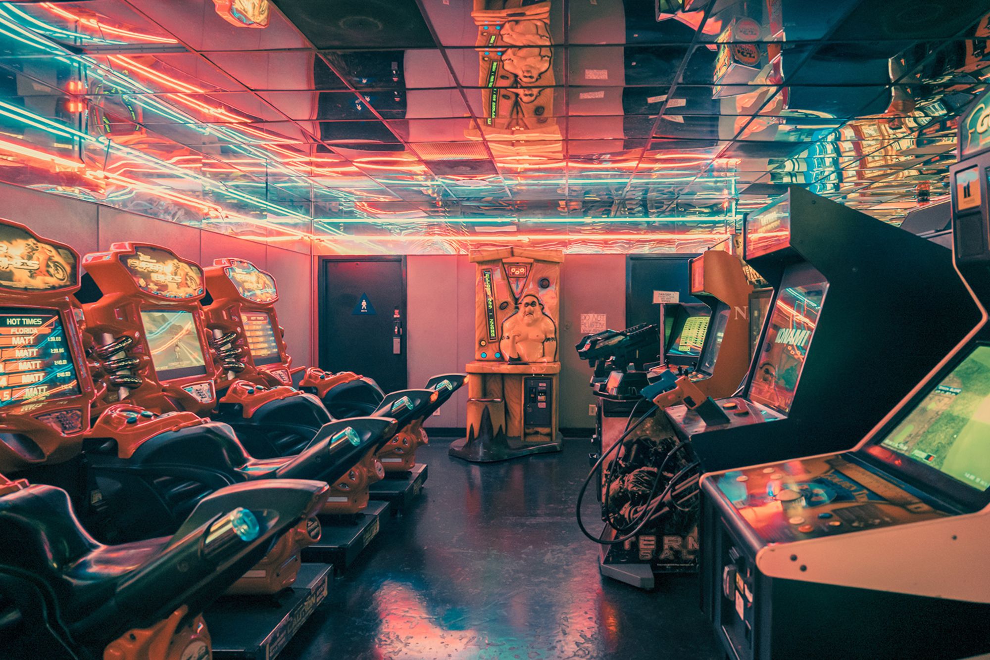 The Family Amusement Corporation arcade in East Hollywood appears bathed in pink light.