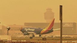 A Southwest airliner approaches LaGuardia Airport in New York, Wednesday, June 7, 2023. The Federal Aviation Administration paused some flights bound for LaGuardia Airport and slowed planes to Newark Liberty and Philadelphia because the smoke from wildfires in Canada was limiting visibility. It also contributed to delayed arrivals at Dulles International Airport outside Washington. (AP Photo/David R. Martin)