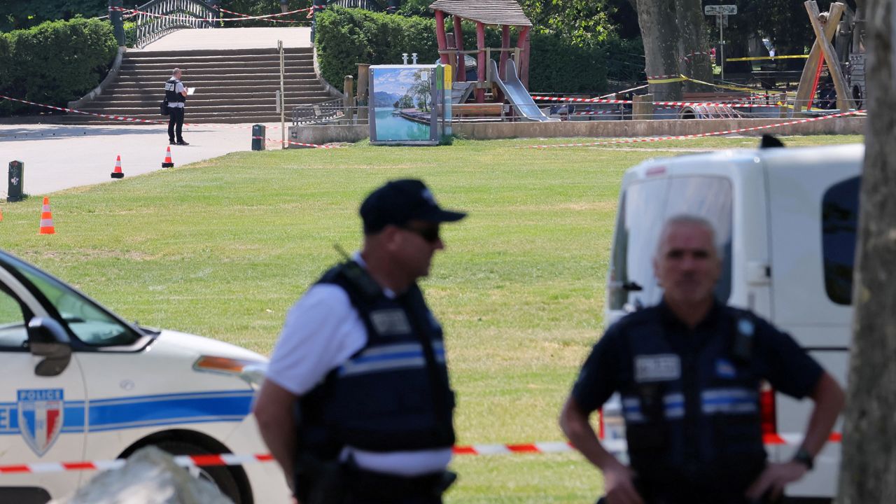 French police secure the area after several children and an adult were injured in Annecy.