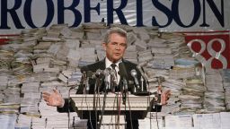 Pat Robertson stands in front of stacks of signatures as he announced his intentions to collect a total of 7 million signatures during a news conference on Sept. 15, 1987 in Chesapeake, Va.