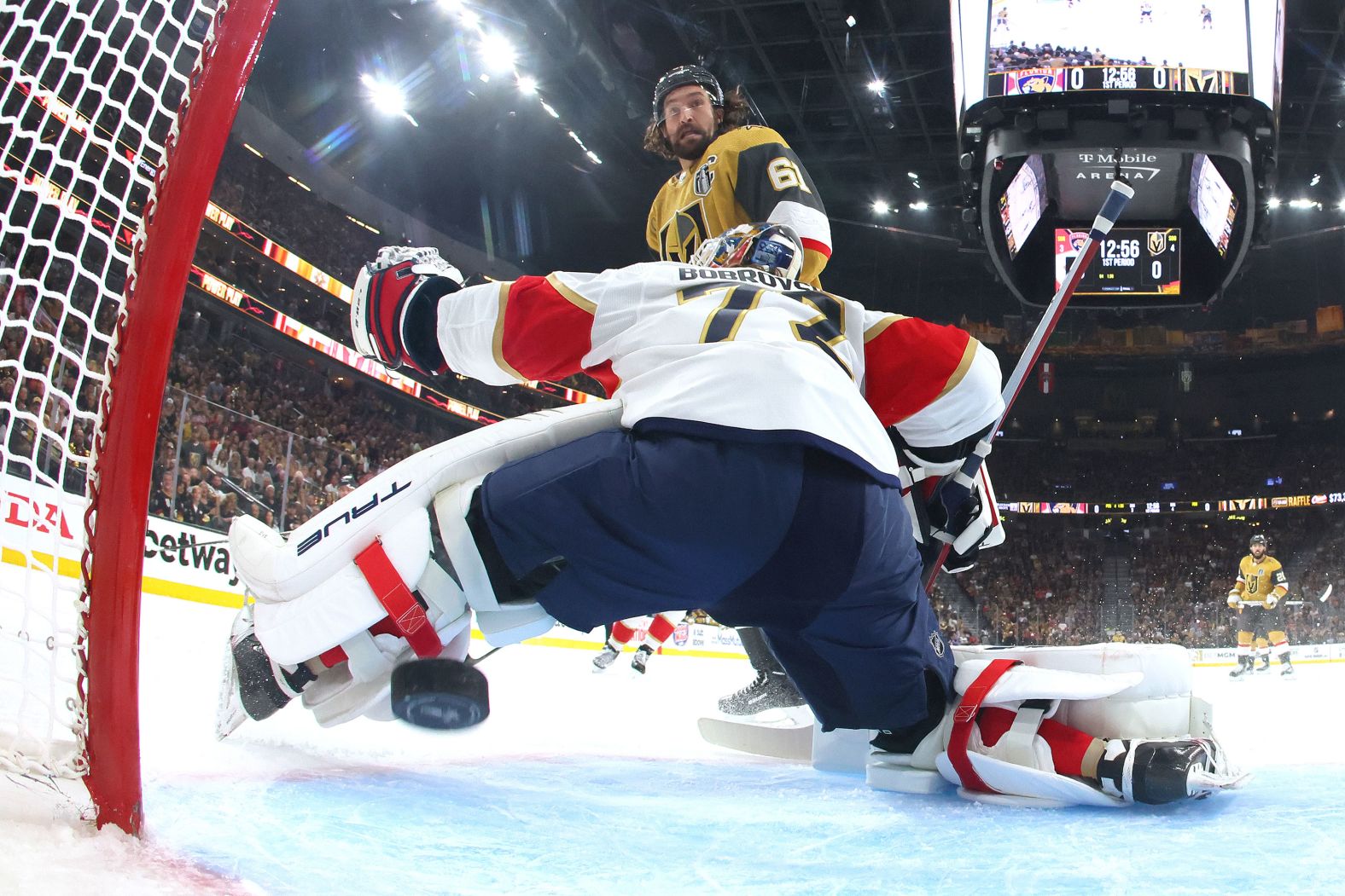 Vegas Golden Knights forward Mark Stone watches a puck pass Florida Panthers goaltender Sergei Bobrovsky during Game 2 of the NHL Stanley Cup Final on Monday, June 5. The Knights won the game to take a 2-0 series lead.